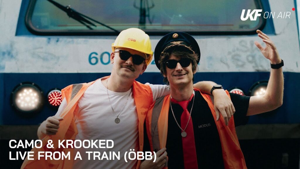 Camo & Krooked in train driver uniforms